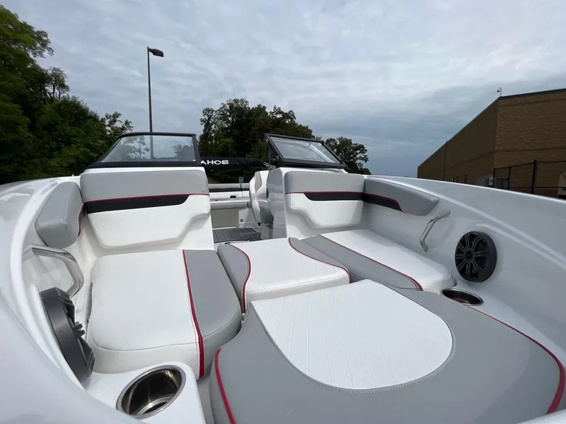 Slide: The Image of 2024 Tahoe 210 Si boat interior with white and gray seating. - 4
