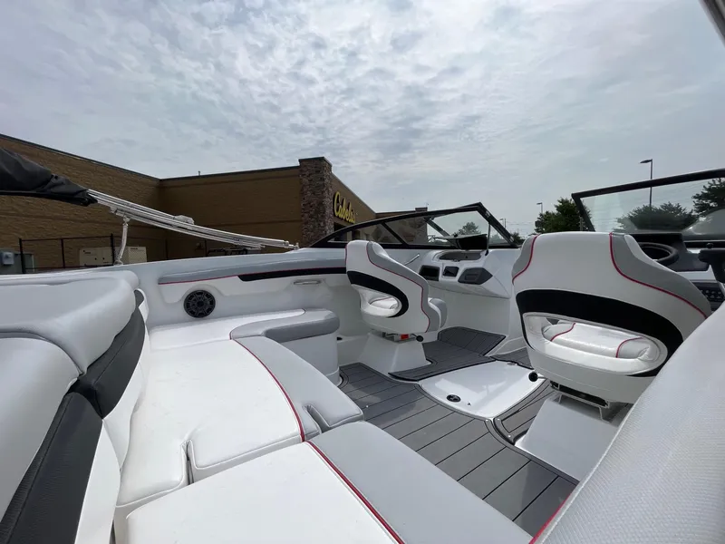 Slide: The Image of Interior of 2024 Tahoe 210 Si boat with white and gray seating. - 5