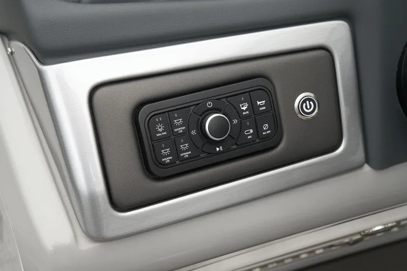 Slide: The Image of Control panel of 2024 Regency 230 DL3 boat with various function buttons. - 41