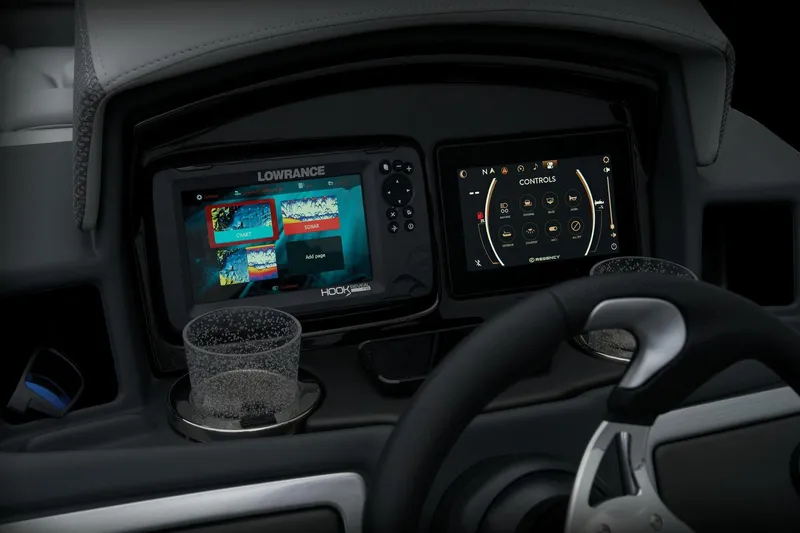 Slide: The Image of 2024 Regency 230 DL3 dashboard with Lowrance and touchscreen controls. - 44