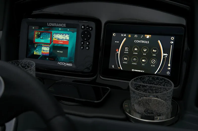 Slide: The Image of 2024 Regency 230 DL3 dashboard with Lowrance and control screens. - 46