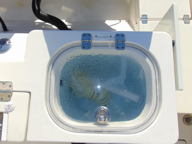 Slide: The Image of Livewell on 2016 Cobia 237 Center Console boat, filled with water. - 11