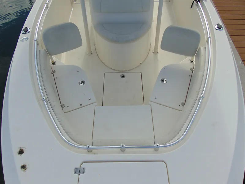 Slide: The Image of 2016 Cobia 237 Center Console boat interior with seating and storage compartments. - 17