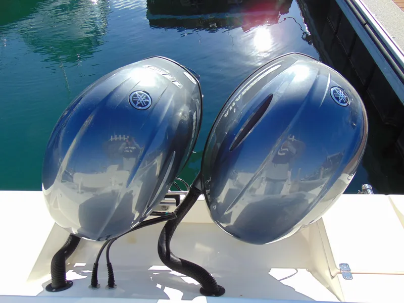 Slide: The Image of Twin Yamaha outboard engines on a 2016 Cobia 237 Center Console boat. - 22
