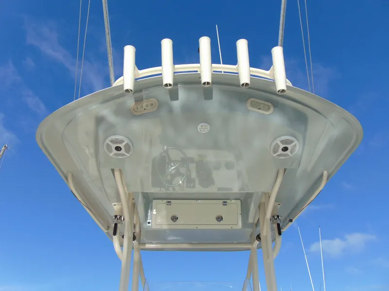 Slide: The Image of 2016 Cobia 237 Center Console boat, viewed from below against a clear blue sky. - 6
