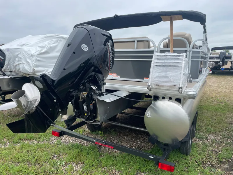 Slide: The Image of 2023 Sun Tracker Party Barge 20 DLX pontoon boat with outboard motor. - 2