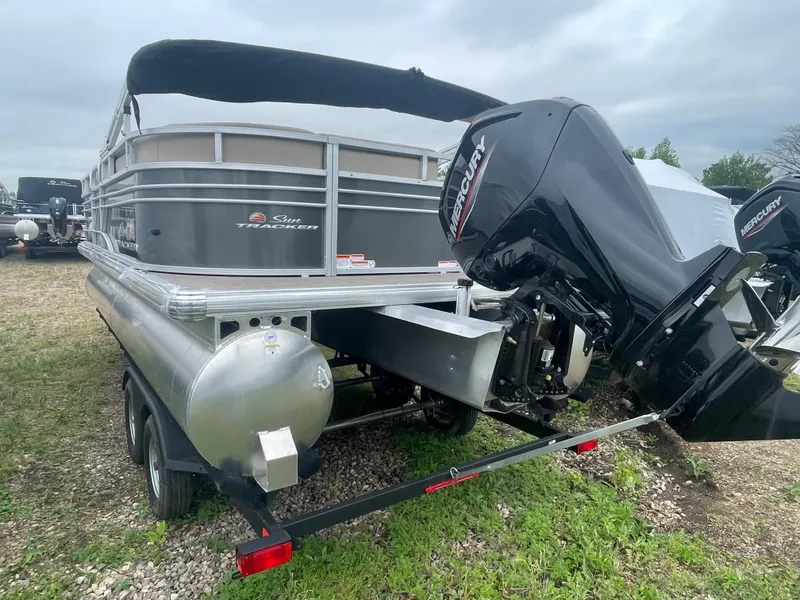 Slide: The Image of 2023 Sun Tracker Party Barge 20 DLX with Mercury outboard motor on trailer. - 3