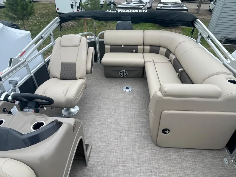 Slide: The Image of 2023 Sun Tracker Party Barge 20 DLX with beige seating and spacious deck layout. - 5