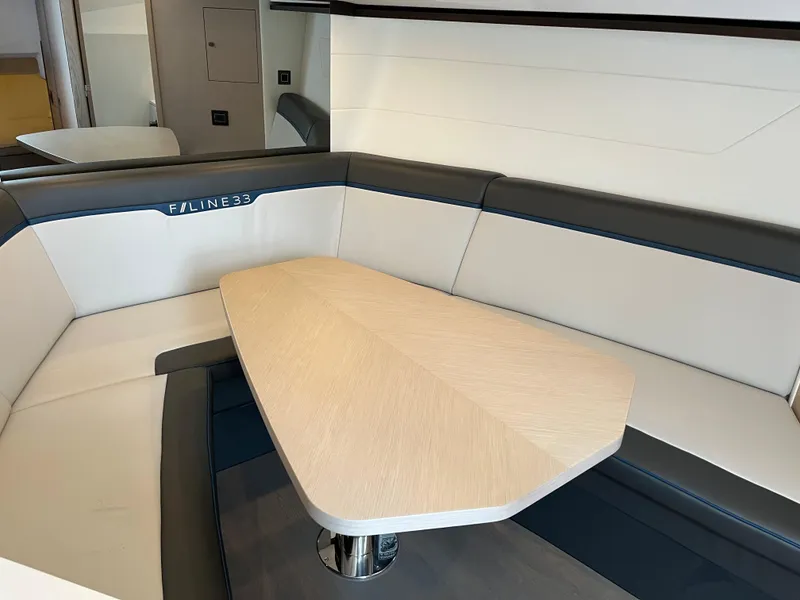 Slide: The Image of Luxurious interior seating of 2022 Fairline F//Line 33 yacht with sleek table design. - 22