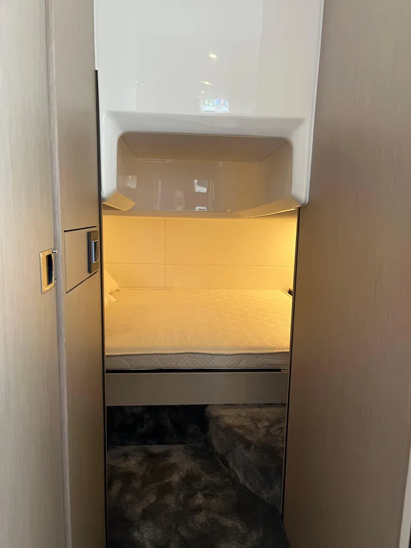 Slide: The Image of Cozy cabin interior of 2022 Fairline F//Line 33 yacht with modern lighting. - 25