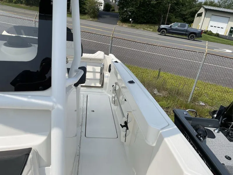 Slide: The Image of 2023 Bayliner Trophy 24 CC boat interior with white deck and seating. - 4