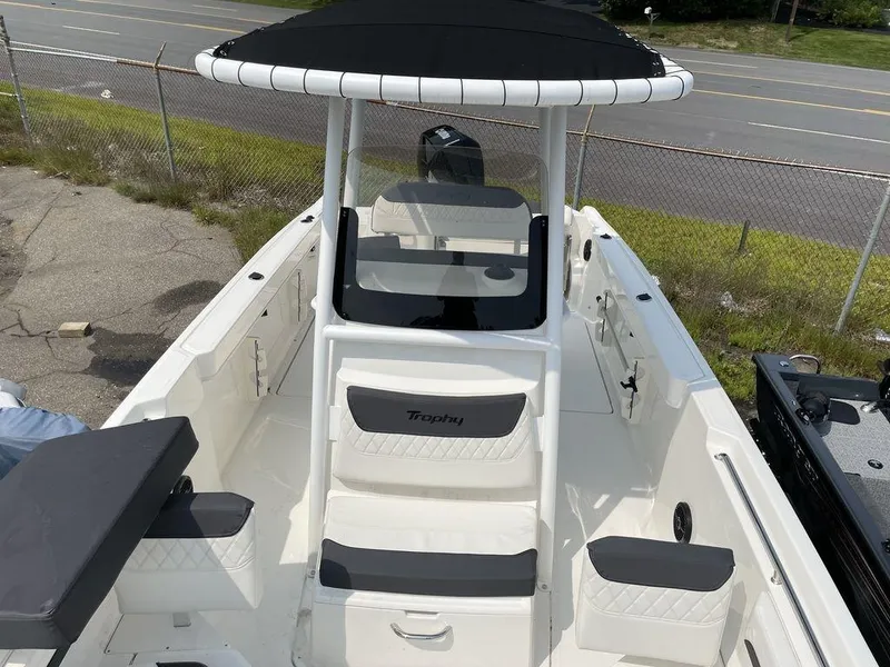 Slide: The Image of 2023 Bayliner Trophy 24 CC center console boat with seating and T-top. - 6