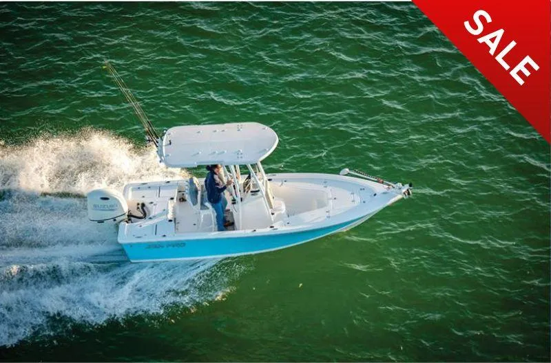 Slide: The Image of 2023 Sea Pro 208 Bay Boat with T-Top on sale, cruising on water. - 1