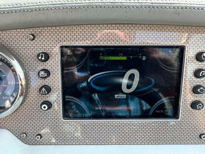 Slide: The Image of Dashboard of a 2017 Regal Fasdeck RX boat showing speedometer and control buttons. - 6