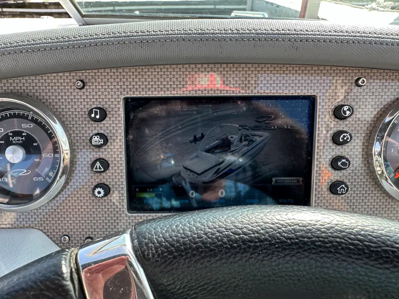 Slide: The Image of Dashboard of a 2017 Regal Fasdeck RX boat with digital display and controls. - 7