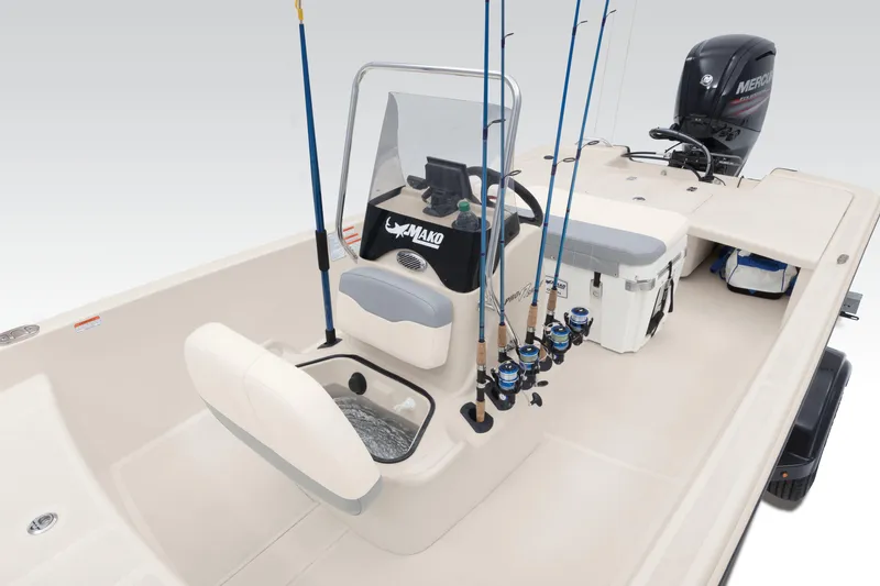 Slide: The Image of 2023 Mako Pro Skiff 17 CC boat interior with fishing rods and console. - 1