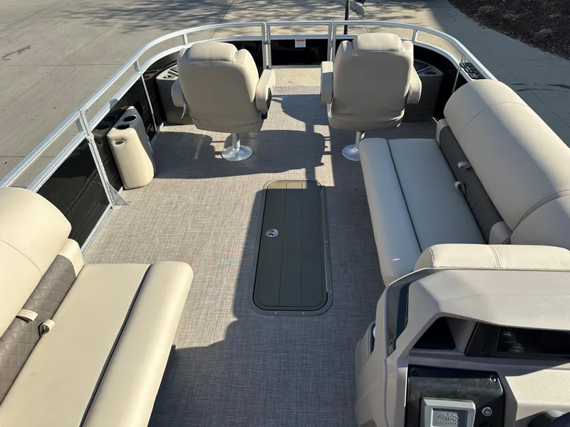 Slide: The Image of 2024 Sun Tracker Sportfish 24 XP3 pontoon boat interior with beige seating and spacious layout. - 4