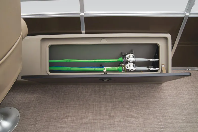 Slide: The Image of Storage compartment with fishing rods on a 2024 Sun Tracker Sportfish 24 XP3 boat. - 45