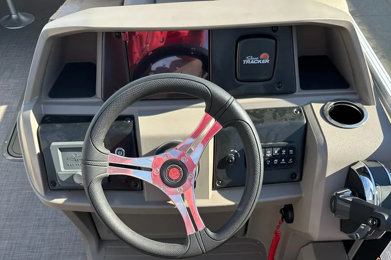 Slide: The Image of 2024 Sun Tracker Sportfish 24 XP3 steering console with modern controls and sleek design. - 6