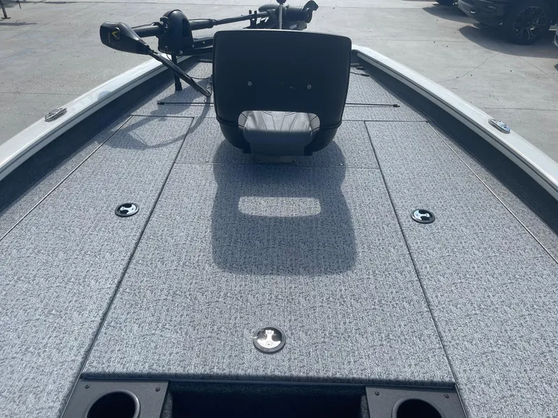 Slide: The Image of 2024 Tracker Pro Team 190 TX boat with Minn Kota Maxxum motor, parked outdoors. - 12