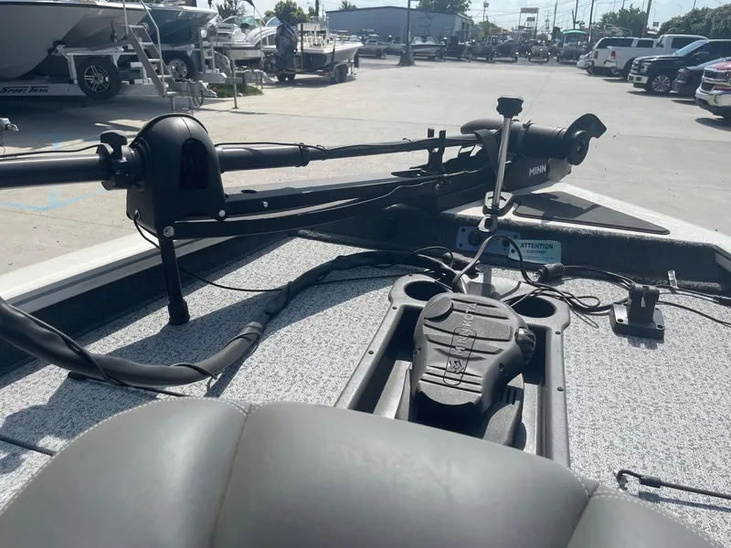 Slide: The Image of 2024 Tracker Pro Team 190 TX boat with open storage compartment, showcasing interior features. - 14