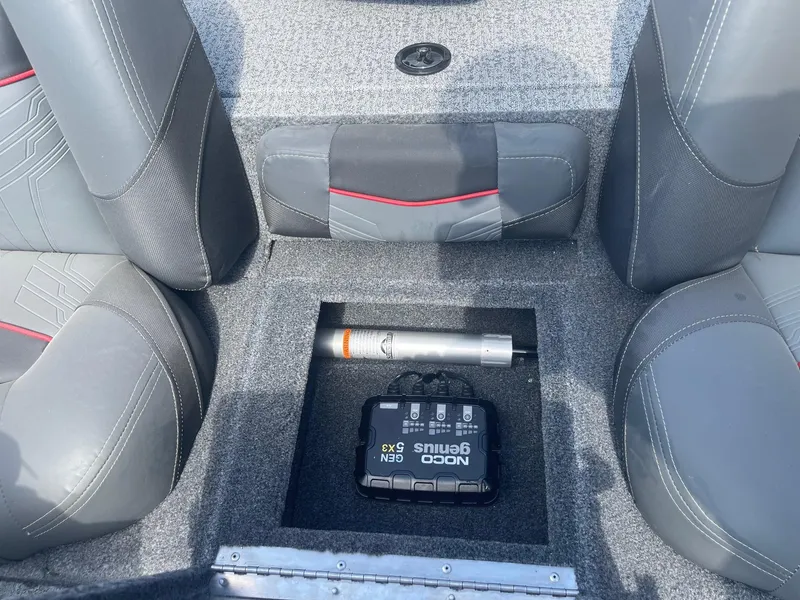 Slide: The Image of 2024 Tracker Pro Team 190 TX boat interior with gray seating and steering console. - 18