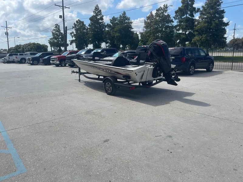 Slide: The Image of 2024 Tracker Pro Team 190 TX boat dashboard with steering wheel and Lowrance device. - 5