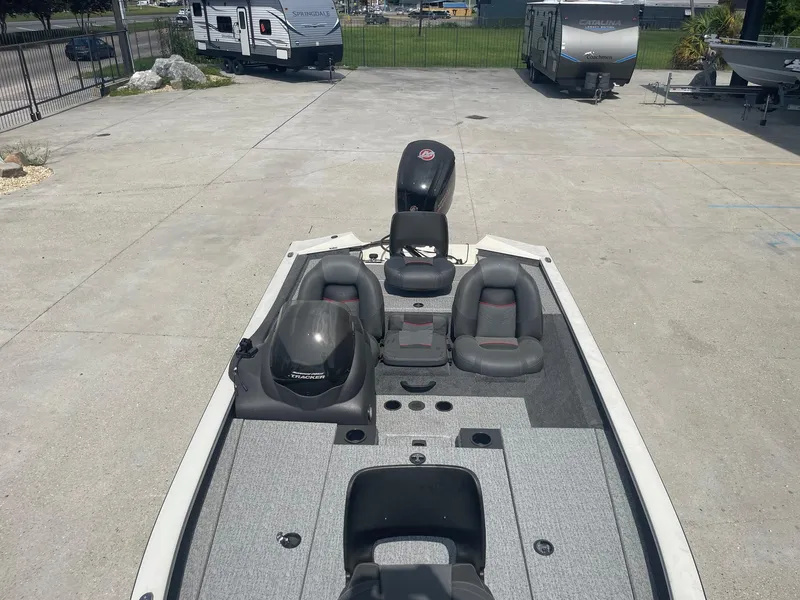 Slide: The Image of 2024 Tracker Pro Team 190 TX boat interior with gray seating and console. - 9