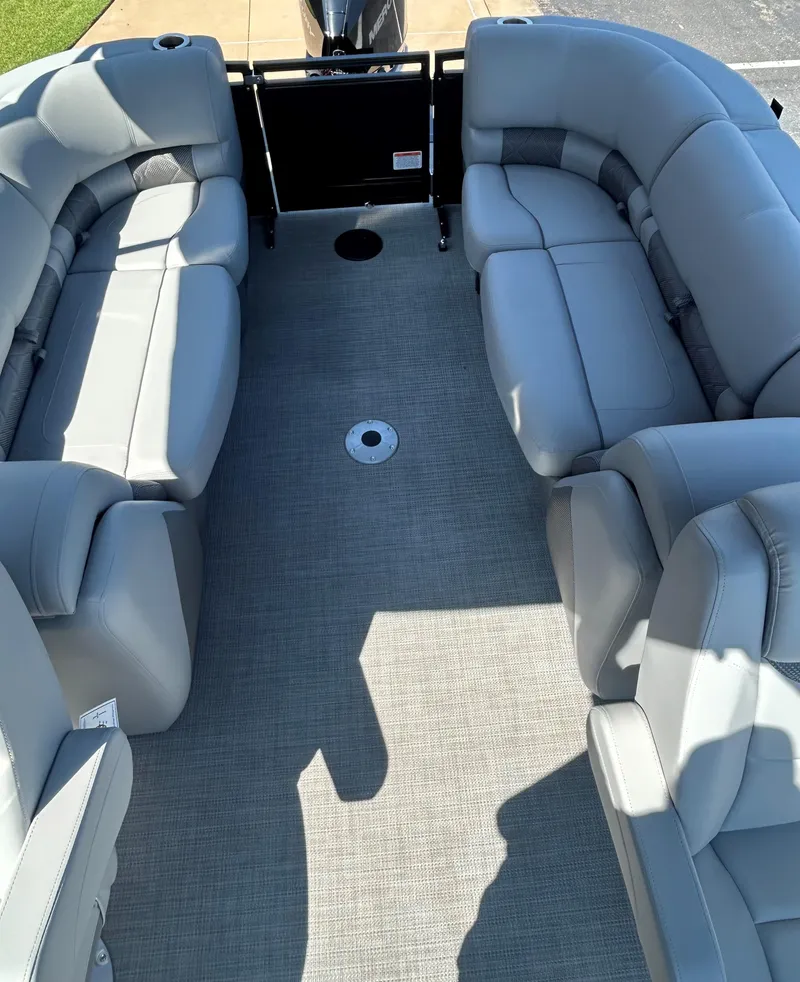 Slide: The Image of 2024 Regency 250 LE3 pontoon boat with spacious seating and modern design. - 12