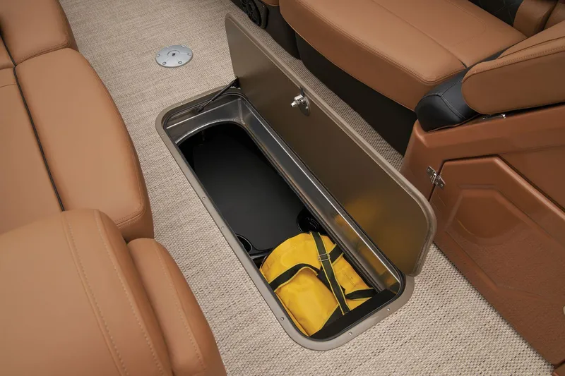 Slide: The Image of 2024 Regency 250 LE3 under-seat storage compartment with yellow bag. - 45