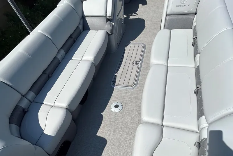 Slide: The Image of 2024 Regency 250 LE3 boat interior with luxurious seating and modern design. - 5