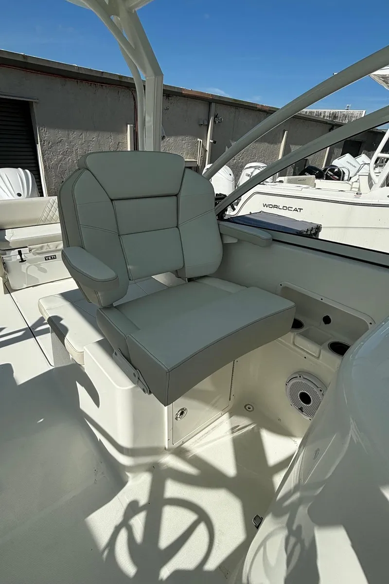 Slide: The Image of 2024 World Cat 296 DC boat with comfortable seating and modern design. - 11