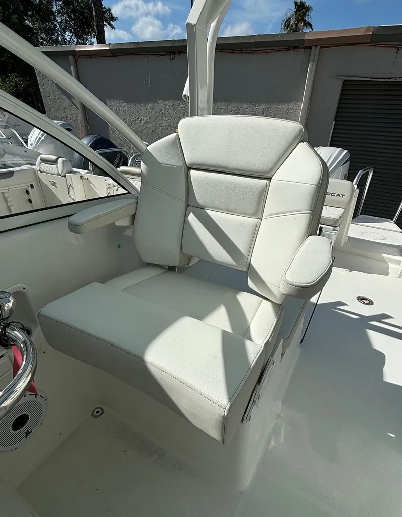Slide: The Image of 2024 World Cat 296 DC boat captain's chair in white upholstery. - 12