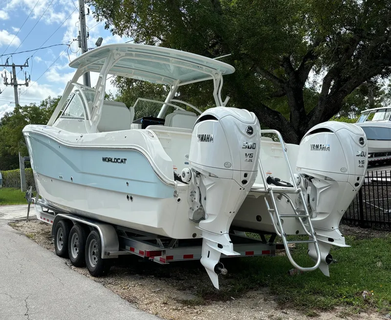 Slide: The Image of 2024 World Cat 296 DC boat on trailer with twin Yamaha engines. - 3