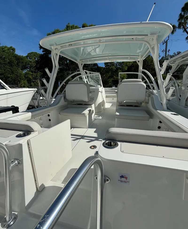 Slide: The Image of 2024 World Cat 296 DC dual console boat with spacious seating and modern design. - 5
