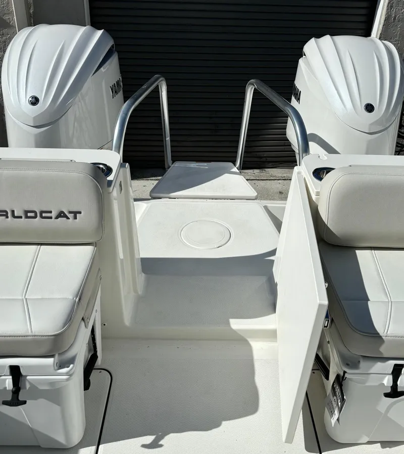 Slide: The Image of 2024 World Cat 296 DC boat with twin Yamaha engines and seating area. - 6