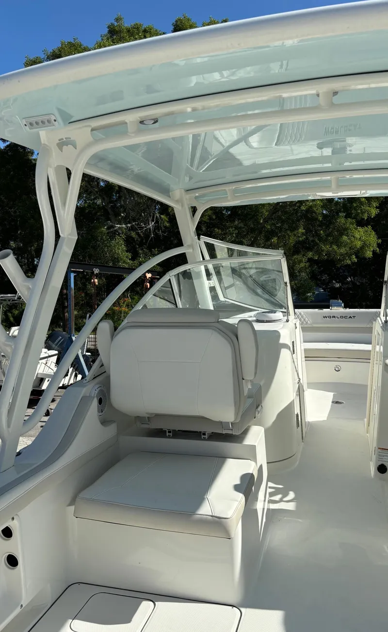 Slide: The Image of 2024 World Cat 296 DC boat interior with seating and canopy. - 8