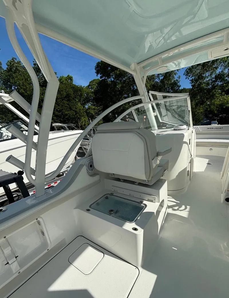 Slide: The Image of 2024 World Cat 296 DC boat interior with seating and console. - 9