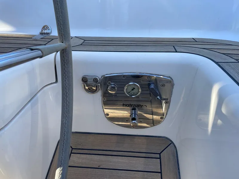 Slide: The Image of Control panel on 2009 Hallberg-Rassy 54 yacht deck with wood finish. - 38