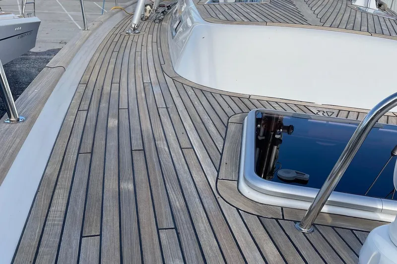 Slide: The Image of Teak deck of 2009 Hallberg-Rassy 54 yacht, showcasing sleek design and craftsmanship. - 42