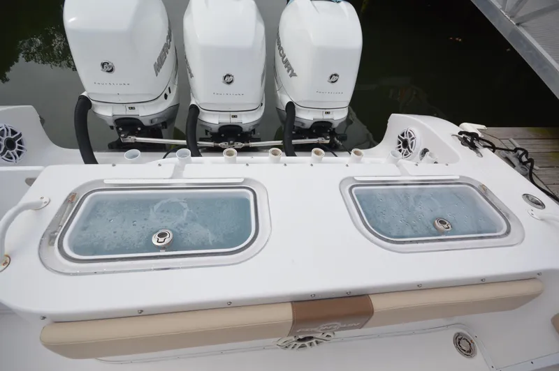 Slide: The Image of 2017 Fountain 38 Center Console with triple Mercury outboard engines. - 10