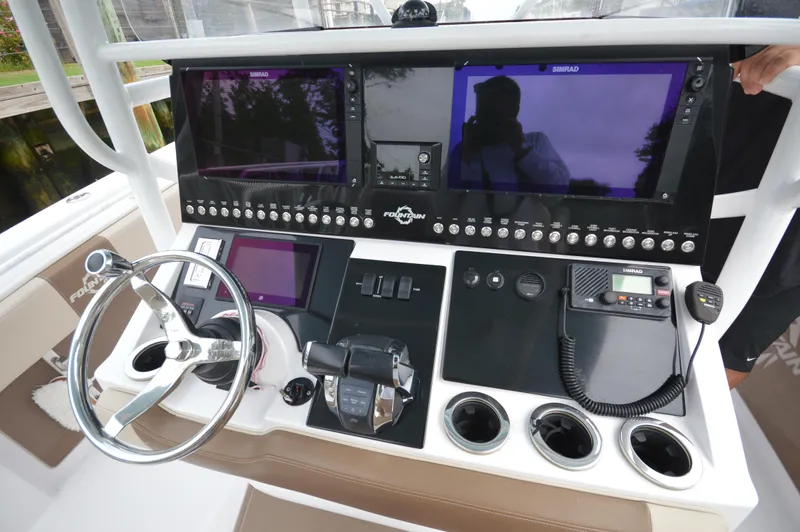 Slide: The Image of 2017 Fountain 38 Center Console boat dashboard with advanced navigation and control systems. - 12