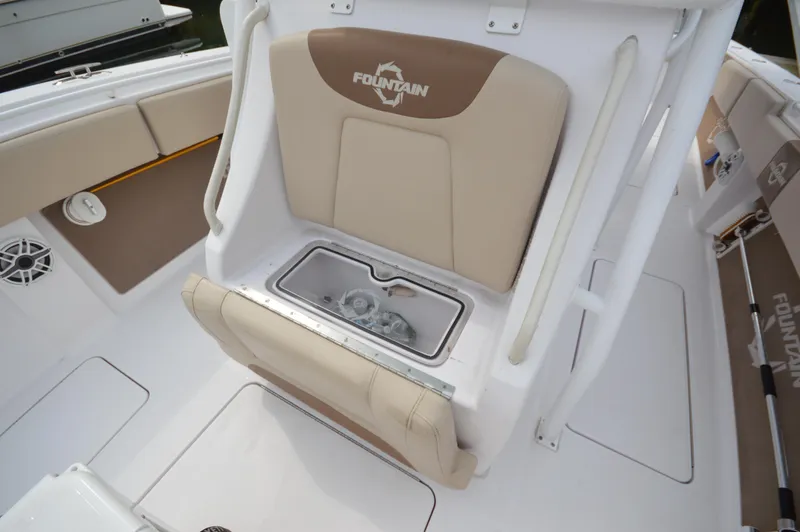 Slide: The Image of 2017 Fountain 38 Center Console boat interior with seating and storage. - 18
