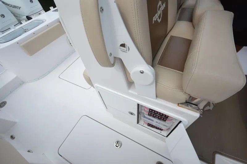 Slide: The Image of 2017 Fountain 38 Center Console boat interior with beige seating and storage compartments. - 23