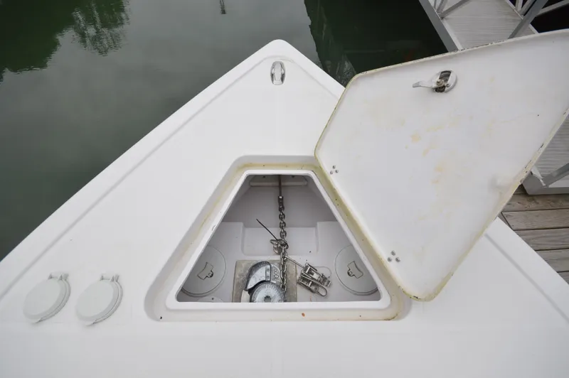 Slide: The Image of Open anchor compartment on 2017 Fountain 38 Center Console boat. - 8