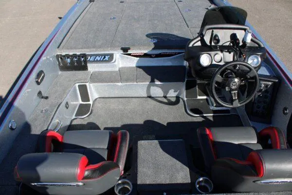 Slide: The Image of 2023 Phoenix 921 ELITE boat interior with dual seats and steering console. - 12