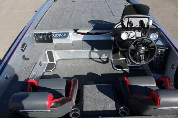 Slide: The Image of 2023 Phoenix 921 ELITE boat interior with dual seats and steering console. - 13