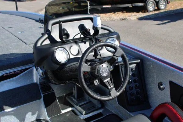 Slide: The Image of 2023 Phoenix 921 ELITE boat dashboard with steering wheel and control panel. - 14
