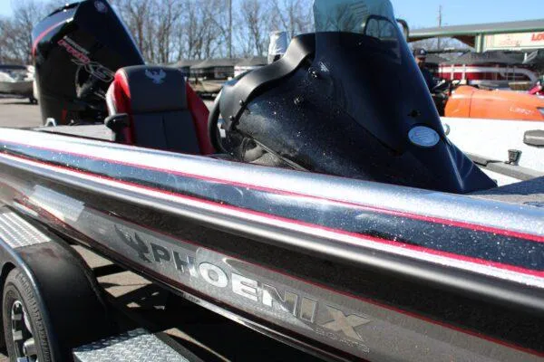 Slide: The Image of 2023 Phoenix 921 ELITE bass boat with sleek design and powerful engine. - 15