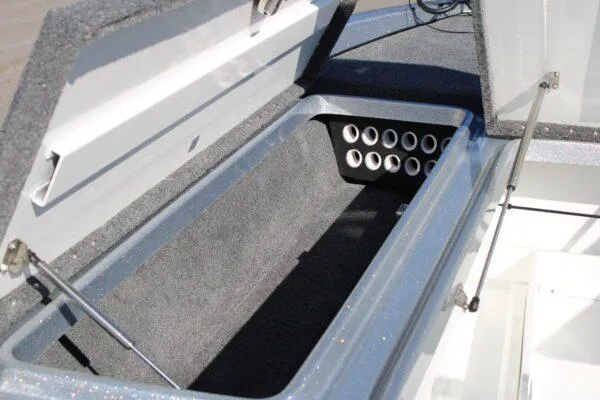 Slide: The Image of 2023 Phoenix 921 ELITE boat storage compartment with rod holders. - 8
